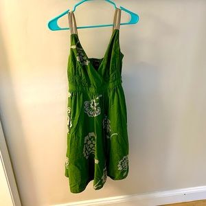 Sweet sundress with silk floral pattern. Fitted at rib cage for a feminine fit.